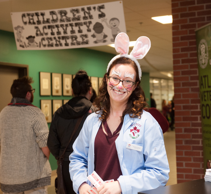 a veterinary student with her face painted like a rabbit