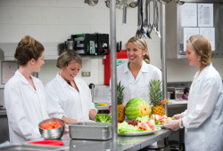 dietetic interns working in an industrial kitchen