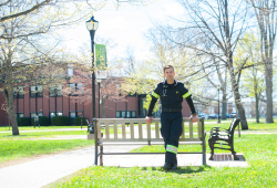 male paramedic standing in the BCA quad